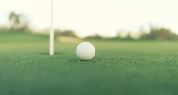 Golf ball close to hole — Stock Photo, Image