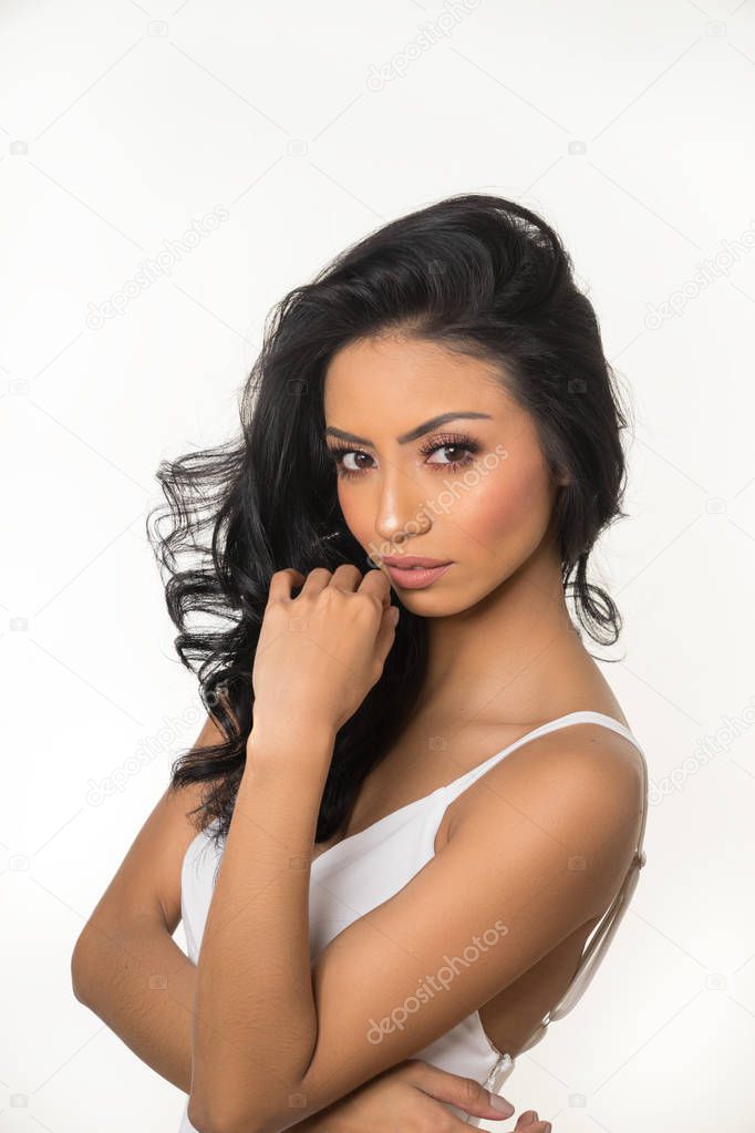 closeup portrait of beautiful   brunette woman posing on white background
