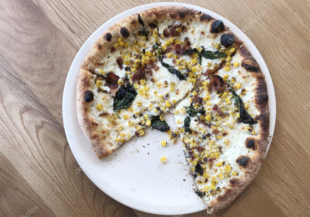 delicious pizza on wooden table. top view