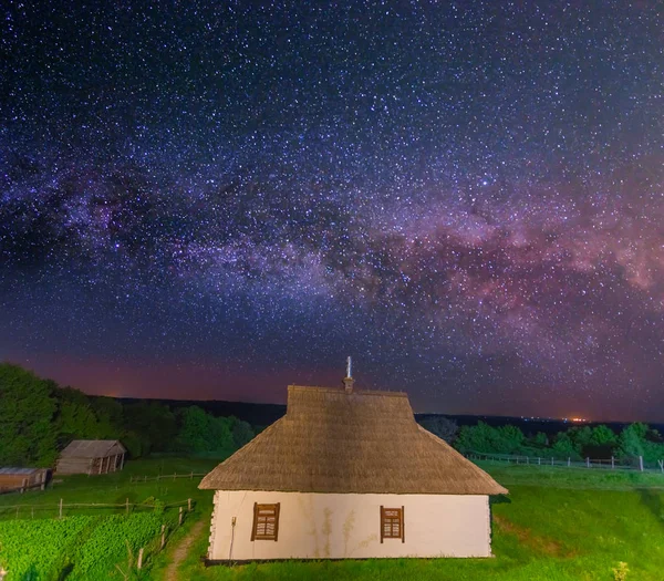 Small house in a night village rural landscape — Stock Photo, Image