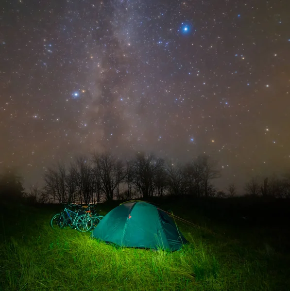 bicycle touristic camp at the night under a milky way