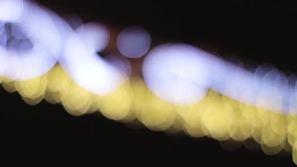 Knipperende lichtjes in bokeh nachts. — Stockvideo