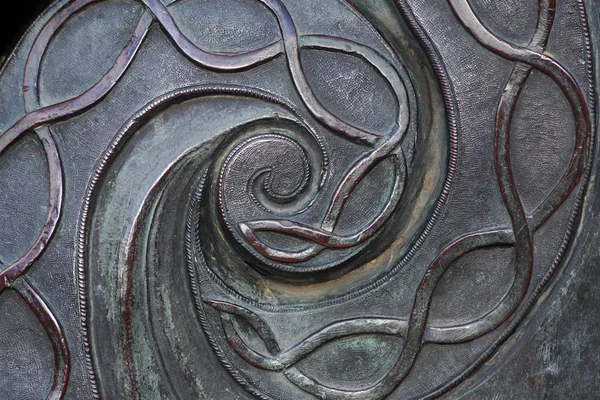 spiral metal pattern. old bronze. bronze texture background.