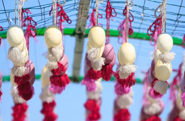 Easter eggs hanging on the ribbons — Stock Photo, Image