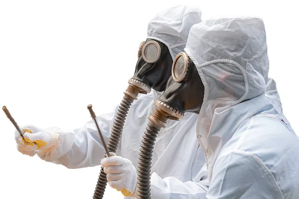 Two men in bio-hazard suits and gas masks with isolated white background.