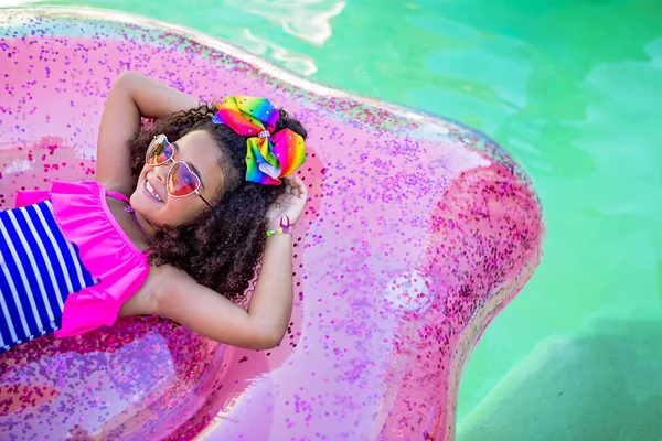 Summer fun cute girl on inflatable raft — Stock Photo, Image