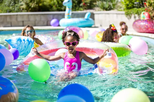 Summer fun cute girls in inflatable rings — Stock Photo, Image