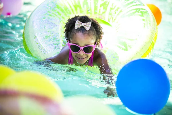 Summer fun cute girl in a inflatable ring — Stock Photo, Image