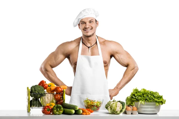 Homem fisiculturista em branco toque blanche e cozinhar avental protetor — Fotografia de Stock
