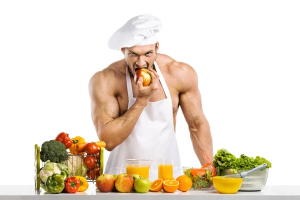 Mann Bodybuilder in weißer Haube und Kochschürze — Stockfoto
