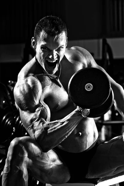 Very power athletic guy , execute exercise with dumbbells — Stock Photo, Image