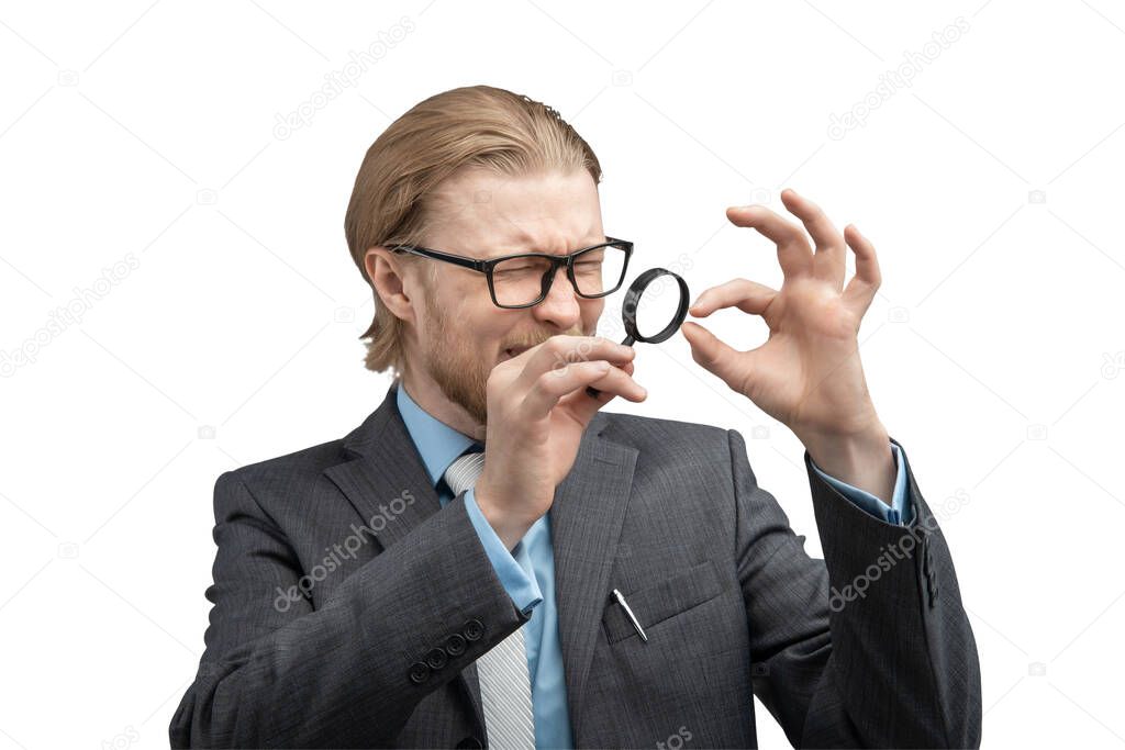 Portrait one man businessman or jeweler with magnifying glass in hand to consider peering, on white background, isolated. Stare, gaze concept