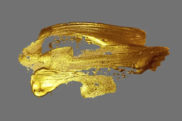 Handzeichnung Goldpinsel Pinselstrich Farbfleck auf grauem Hintergrund — Stockvektor