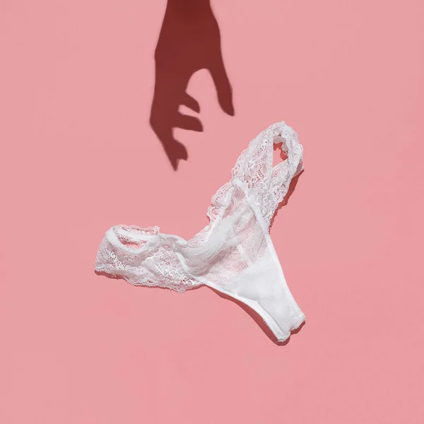 Sexy White Lace Bra And Panties On Pink Background. Stylish