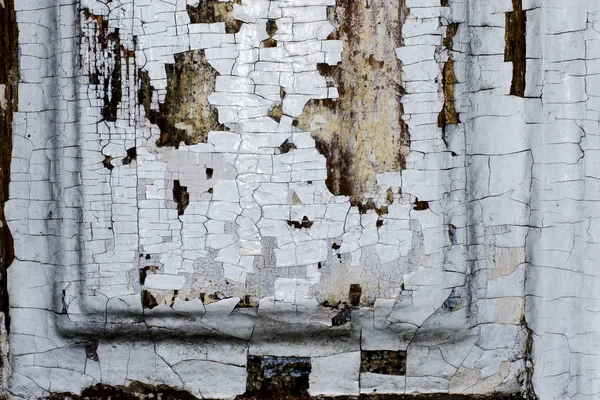 Konsistens av en shabby gammal vit färg på en trädörr — Stockfoto