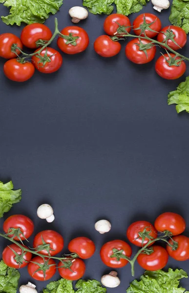 Tomatoes on a black background. Dietary food. Vegetables on a black background. Tomatoes on the table.