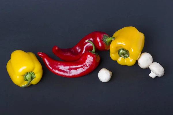 Yellow Red Peppers Mushrooms Dark Background Composition Peppers Mushrooms Dark — Stock Photo, Image