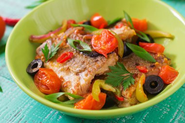 Fried hake fillet with tomato and olives clipart