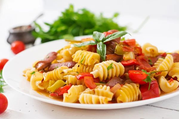 Pasta with tomato sauce with sausages — Stock Photo, Image