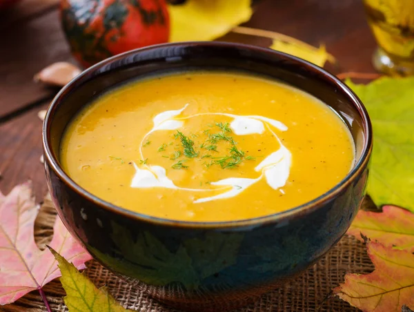 Pumpkin soup with sour cream sauce — Stock Image Pumpkin soup with sour cream sauce Royalty Free Stock Photos