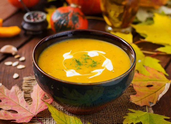 Pumpkin soup with sour cream sauce — Stock Image Pumpkin soup with sour cream sauce Stock Photo