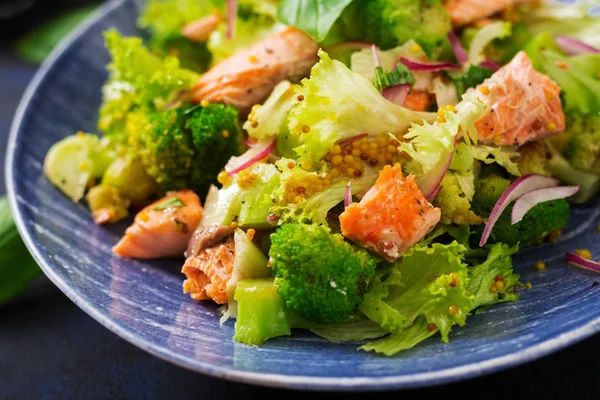 Salad of stewed fish salmon on plate