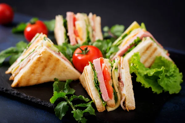 Club sandwiches on dark background. — Stock Photo, Image
