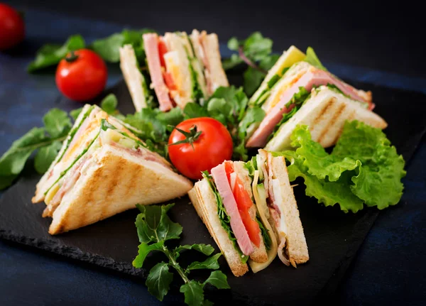 Club sandwiches on dark background. — Stock Photo, Image