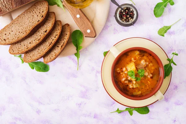 Soup with pickled cucumbers and pearl barley — Stock Photo, Image