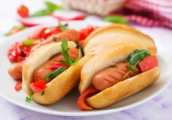 Hot dogs with sausages and vegetables — Stock Photo, Image