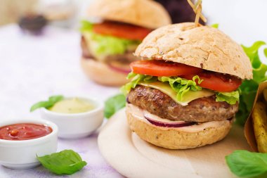 Beef burger with sauces clipart