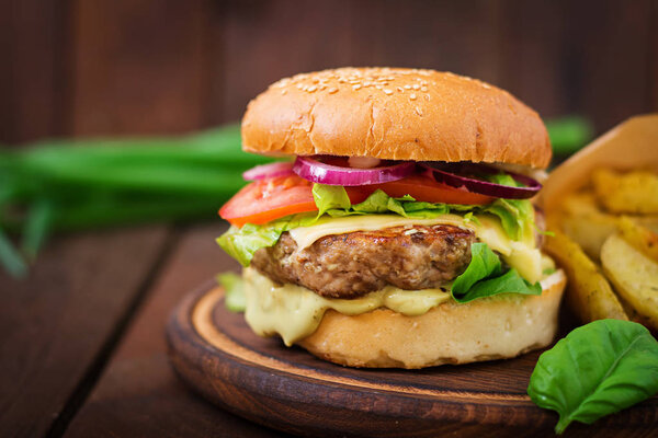 Beef burger with cheese tomato and onion