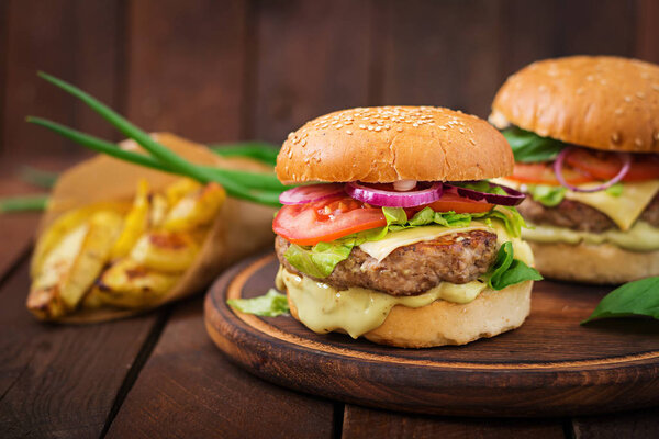 beef burgers on wooden plate