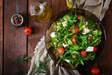 Salad of vegetables with feta cheese and nuts clipart