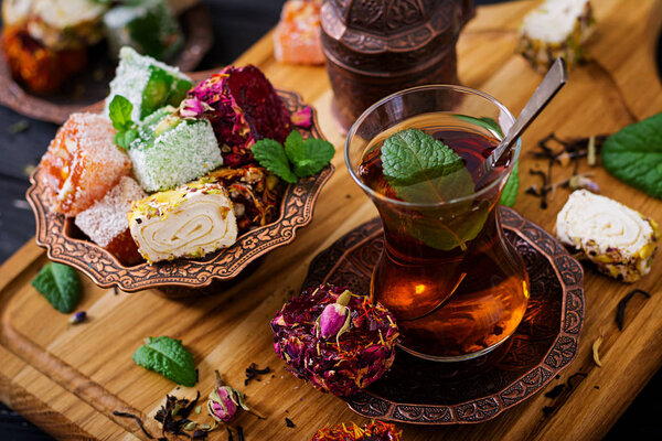 Bowl with turkish delight and black tea