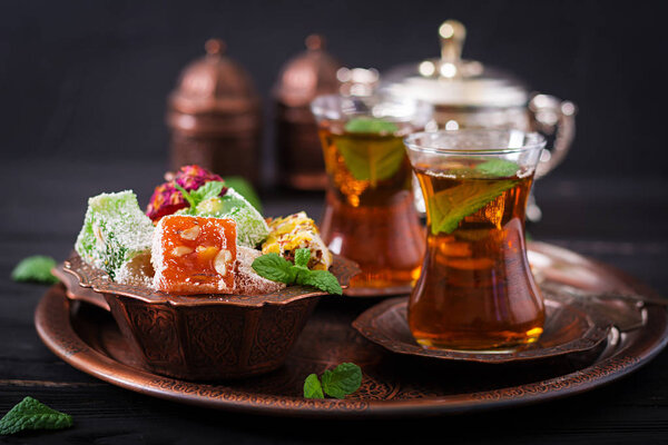 Bowl with turkish delight and black tea