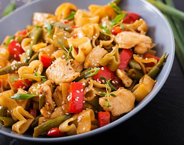 Stir Fry from chicken fillet with pasta — Stock Photo, Image
