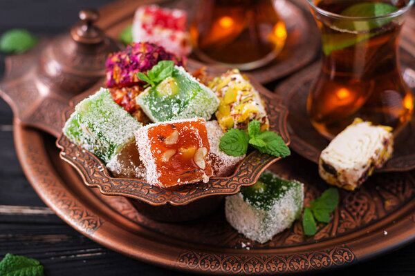 Bowl with turkish delight and black tea