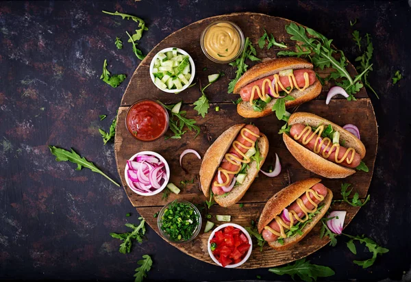 Hot dogs on wooden background — Stock Photo, Image