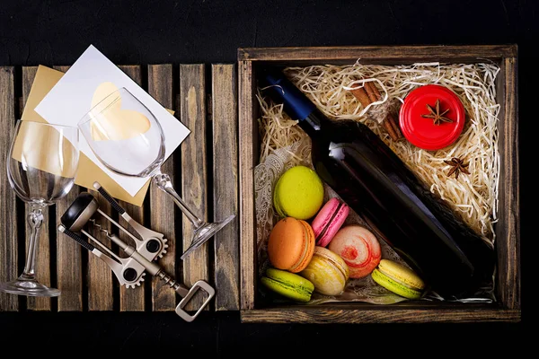 Bottle of white wine and a macarons — Stock Photo, Image