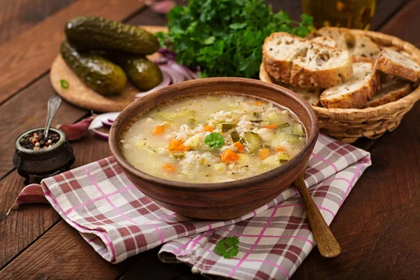 Soup with pickled cucumbers and pearl barley - rassolnik on a wooden background. — Stock Image Soup Pickled Cucumbers Pearl Barley Rassolnik Wooden Background Stock Photo