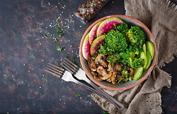 Vegan buddha bowl dinner food table. Healthy food. Healthy vegan lunch bowl. Grilled mushrooms, broccoli, radish salad. Flat lay. Top view.