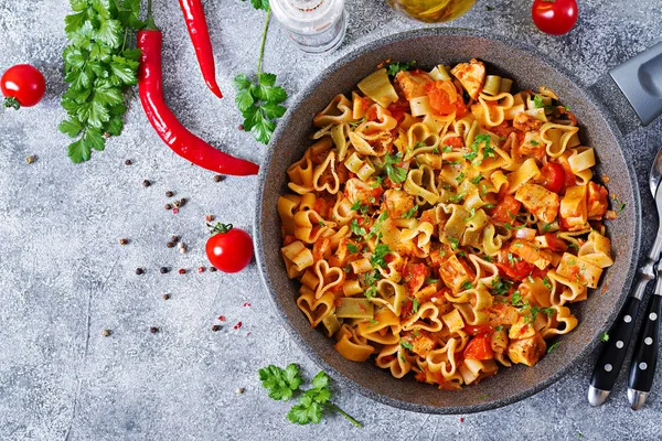 pasta in shape of hearts with chicken and tomatoes in tomato sauce