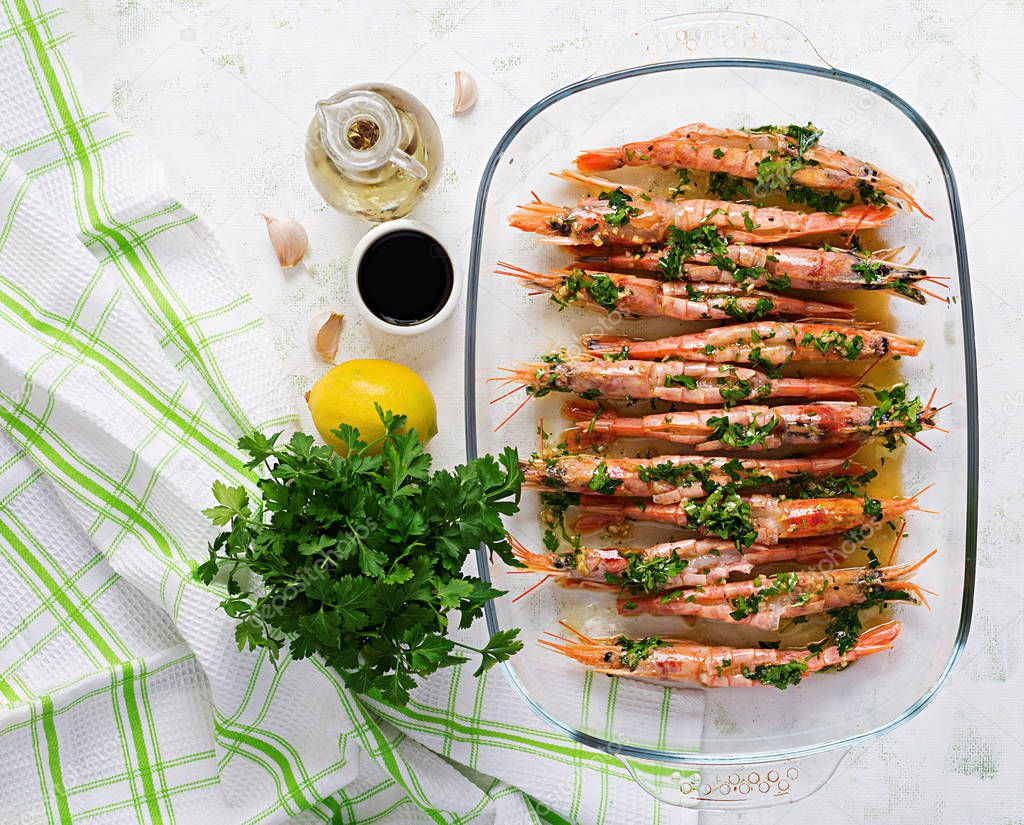 Grilled wild Argentinian red shrimps/prawns with parsley, oil, garlic and lemon. Delicious food. Keto / Paleo Diet. Top view, overhead