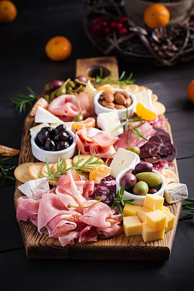 Antipasto Platter Ham Prosciutto Salami Cheese Crackers Olives Wooden Background — 스톡 사진