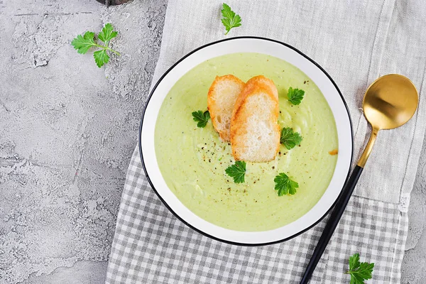 Homemade broccoli cream soup with croutons in white bowl on grey background. Healthy vegetarian food. Vegan menu. Top view, copy space — Stock Image Homemade Broccoli Cream Soup Croutons White Bowl Grey Background Healthy Royalty Free Stock Images