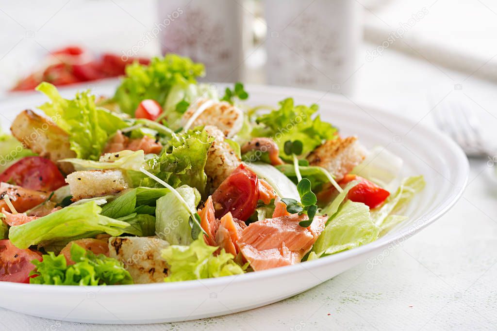 Caesar Salad with Salmon. Fish menu. Seafood - salmon.