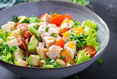 Healthy cobb salad with chicken, avocado, bacon, tomato, cheese and eggs. American food. clipart