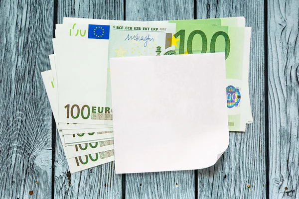 Billetes en euros y papel en blanco — Foto de Stock