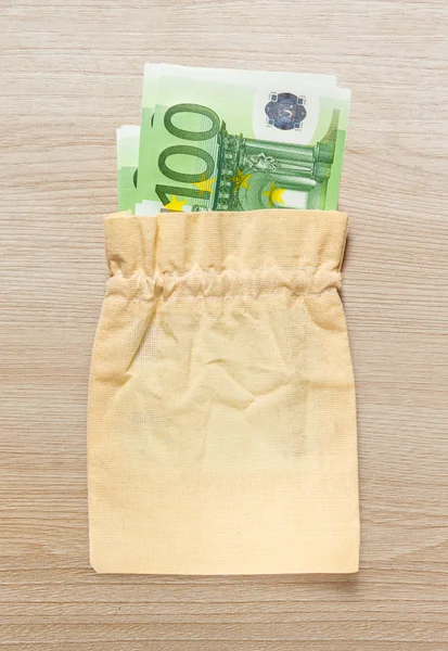 One hundred euro banknotes in linen sack — Stock Photo, Image